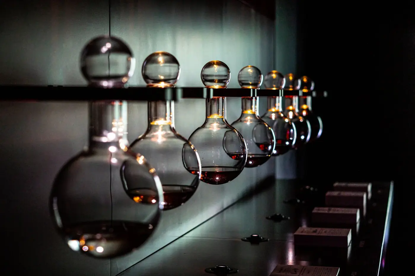 Laboratory glassware on a dark bench