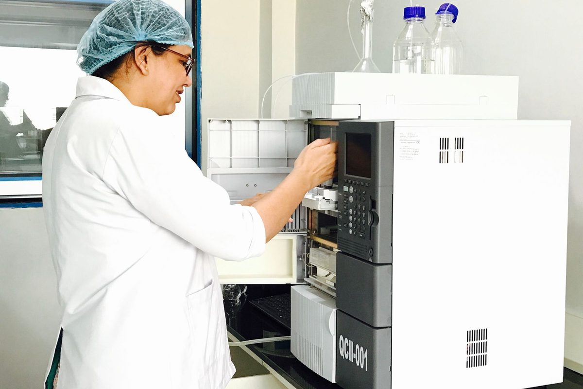 Chemist working at an HPLC system